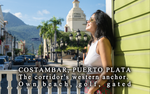 Costambar beach at the western end of the Puerto Plata–Cabarete corridor, with the community's condos and villas along the shore