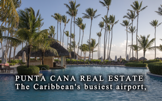 Aerial view of the Punta Cana coastline with beachfront condominiums, golf courses and palm groves